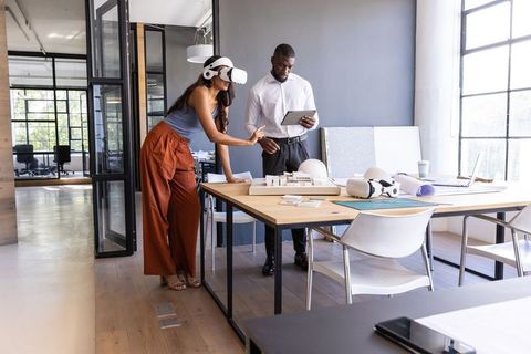 Architects Using VR Headsets Collaboration in Modern Office