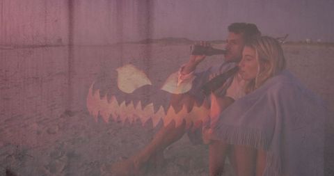 Romantic Couple Relaxing on Beach at Dusk