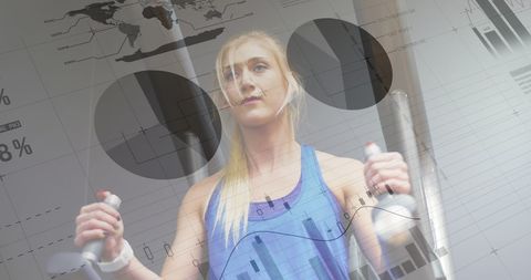 Caucasian woman exercising in gym with digital graph overlay