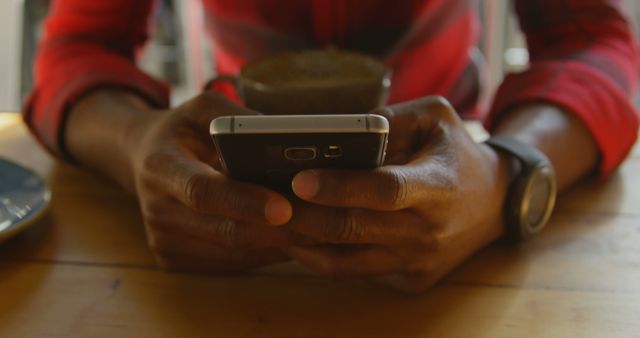 Close-Up of Man Using Smartphone While Drinking Coffee - Download Free Stock Images Pikwizard.com