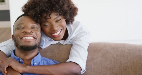 Happy Couple Embracing on Couch at Home - Download Free Stock Images Pikwizard.com