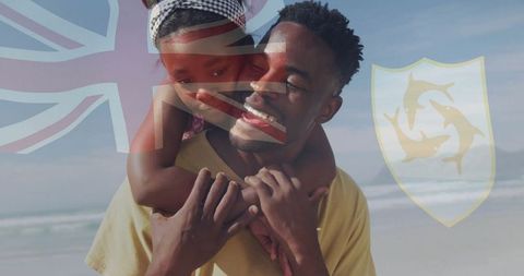 Joyful Father and Daughter Bonding on Sunny Beach Day