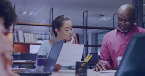 Team Collaboration in Modern Office Setting with Diverse Coworkers