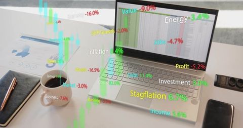 Laptop with Data Visualization and Economic Indicators on Desk