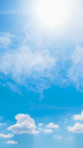 Vertical sky video streaming sunbeams through cirrus and puffy cumulus clouds