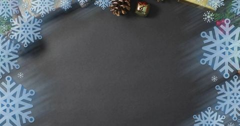 Framing chalkboard holiday border with blue snowflakes, pine cones, gold bell