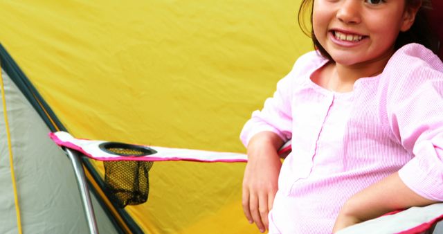 Joyful Girl Relaxing Near Colorful Camping Tent - Download Free Stock Images Pikwizard.com