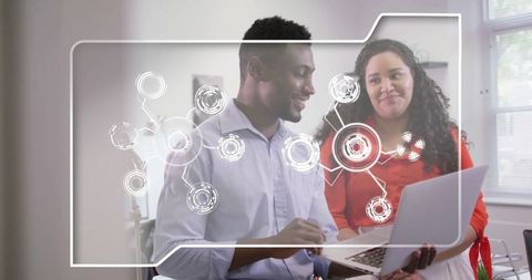 Office colleagues collaborating with digital interface