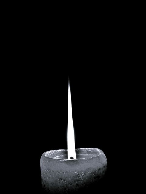 Single White Candle in Darkness with Soft Glow - Download Free Stock Photos Pikwizard.com