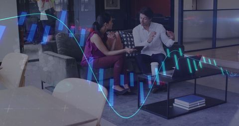 Business Colleagues Analyzing Financial Charts in Modern Office