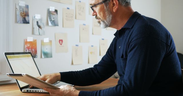 Older Man Working from Home on Laptop at Desk - Download Free Stock Images Pikwizard.com