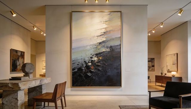 Oversized abstract canvas with metallic flecks in minimalist contemporary gallery interior