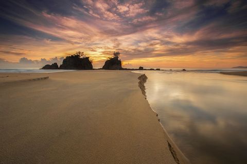 Golden Sunset Over Pristine Beach with Rock Islands and Reflective Tidal Channel, Dramatic Sky