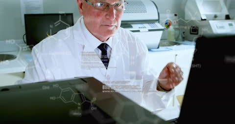 Senior Scientist Analyzing Medical Data in Laboratory Setting