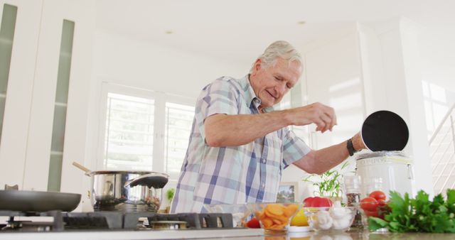 Senior Man Enjoying Cooking in Bright Modern Kitchen - Download Free Stock Images Pikwizard.com