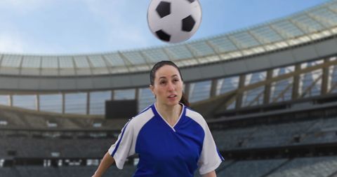 Female Soccer Player Heading Football in Stadium Evokes Team Spirit - Download Free Stock Images Pikwizard.com