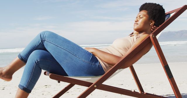 Woman Relaxing on Beach Chair at Sunny Beach - Download Free Stock Images Pikwizard.com