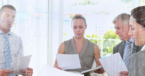 Multitasking Caucasian Business Professionals in a Modern Office