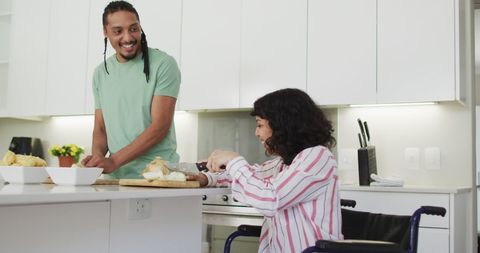 Couple Cooking Together Featuring Woman in Wheelchair: Inclusive Domestic Scene - Download Free Stock Images Pikwizard.com