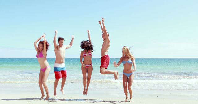 Friends Jumping on Beach Having Fun In Summer - Download Free Stock Images Pikwizard.com