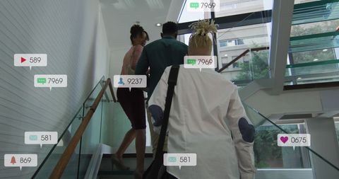 Diverse colleagues climbing stairs with social media influence