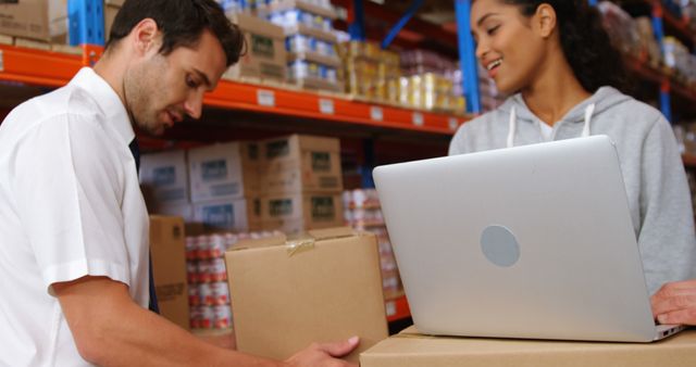 Warehouse Workers Managing Inventory and Checking Stock with Laptop - Download Free Stock Images Pikwizard.com