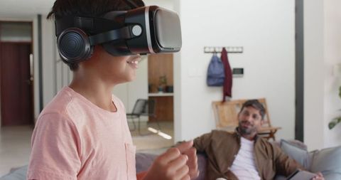 Father and Son Sharing Virtual Reality Experience at Home