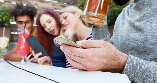 Group of Young Friends Sharing and Laughing While Checking Phones - Download Free Stock Images Pikwizard.com