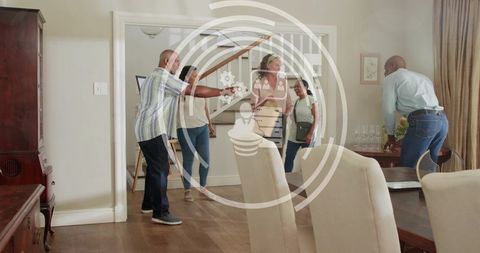 Group welcoming guests in home entryway, guiding tour past staircase, preparing drinks