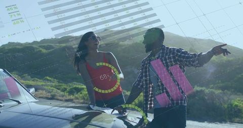 Couple leaning on car and pointing at scenic hillside while chatting with data overlays