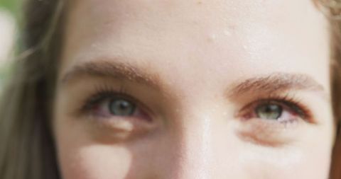 Close Up on Happy Woman's Eyes at Sunny Outdoor Celebration