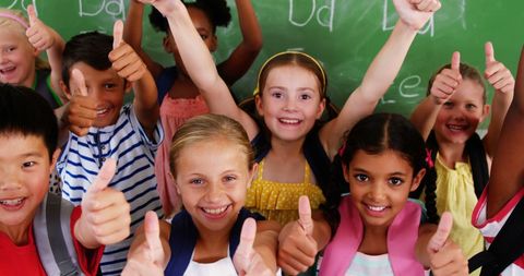 Diverse Group of Happy Schoolchildren Giving Thumbs Up - Download Free Stock Images Pikwizard.com