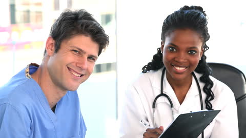 Two Medical Professionals Collaborating in Bright Office