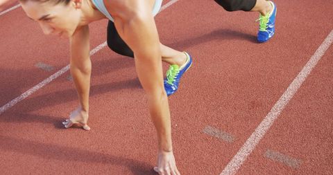 Female Athlete in Starting Position for Sprint Race on Track - Download Free Stock Images Pikwizard.com