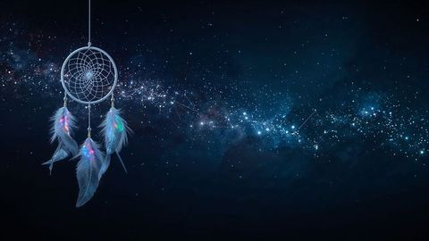 Dreamcatcher Against Starry Sky with Sparkling Cosmic Trail