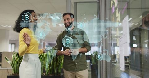 Professionals Analyzing Holographic Bitcoin Map in Futuristic Office