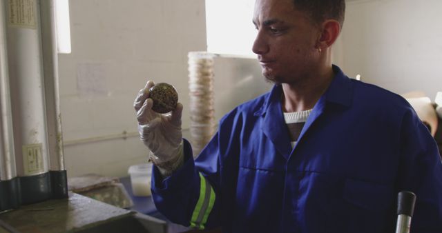 Male Technician Inspecting a Metal Bearing in Workshop - Download Free Stock Images Pikwizard.com