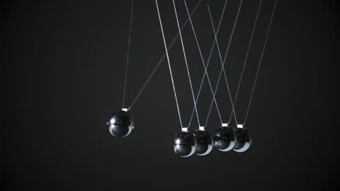 Shiny Newton's Cradle Pendulum Swinging in Motion