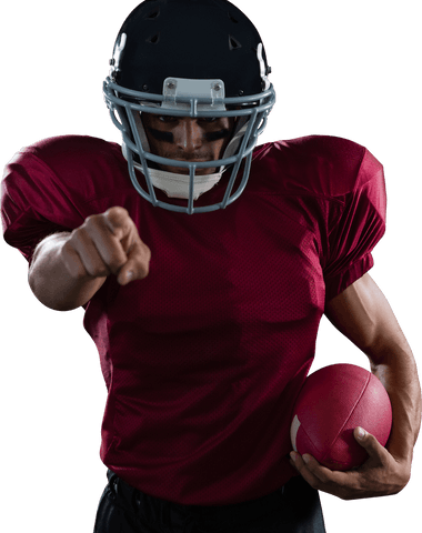 Photo features a focused American football player dressed in a red top while pointing forward, holding a football in one hand. Image conveys action and determination, ideal for sports promotions, athletic gear advertising, or motivational content.