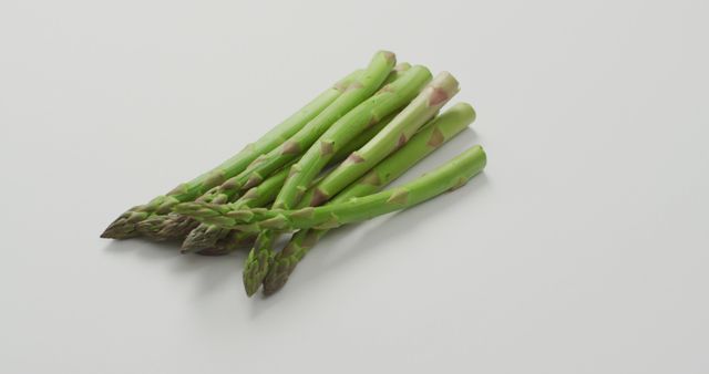 Image of fresh asparagus with copy space over white background. fusion food, fresh vegetables and healthy eating concept.