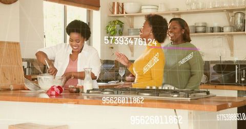 Stirring mixing and laughing at kitchen island with cooktop and recipe prep