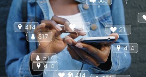 Tapping Smartphone with Floating Social Media Notifications, Hands in Denim Jacket