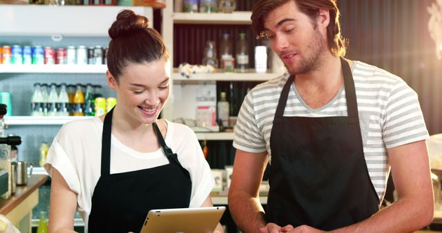 Happy Cafe Staff Using Digital Tablet for Customer Orders - Download Free Stock Images Pikwizard.com