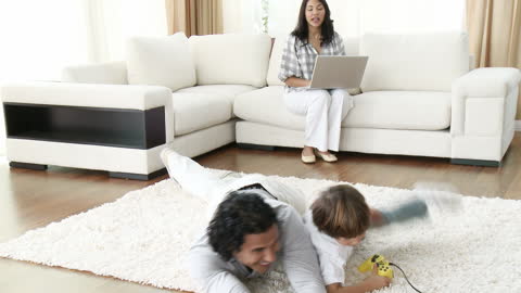 Family Enjoying Video Games and Relaxing at Home