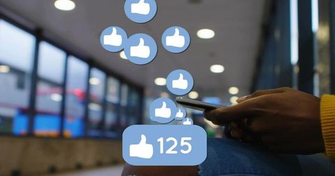 Woman Using Smartphone in Transit Concourse Getting Social Media Likes Notifications