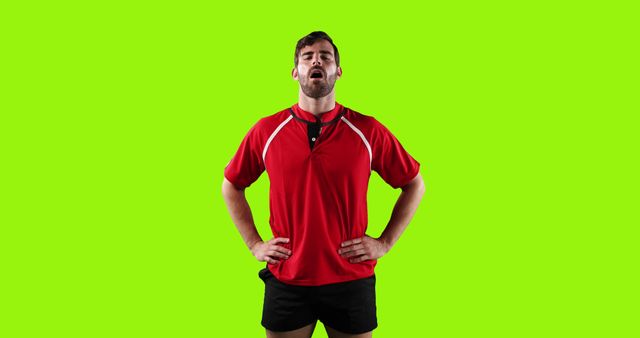 Exhausted Male Athlete in Red Sportswear Standing Against Green Background - Download Free Stock Images Pikwizard.com