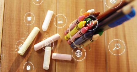 Chalk and colorful icons representing digital learning and creativity