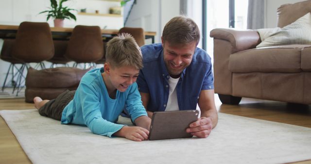 Father and Son Enjoying Digital Tablet Together at Home - Download Free Stock Images Pikwizard.com