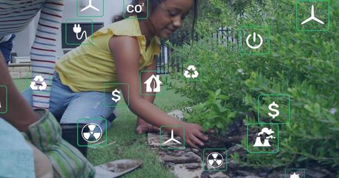 Child planting sapling in backyard garden surrounded by eco icons and green energy symbols
