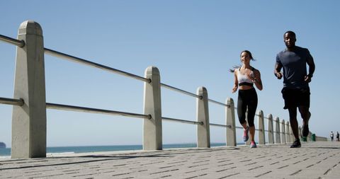 Fit Couple Jogging on Scenic Ocean Promenade - Download Free Stock Images Pikwizard.com